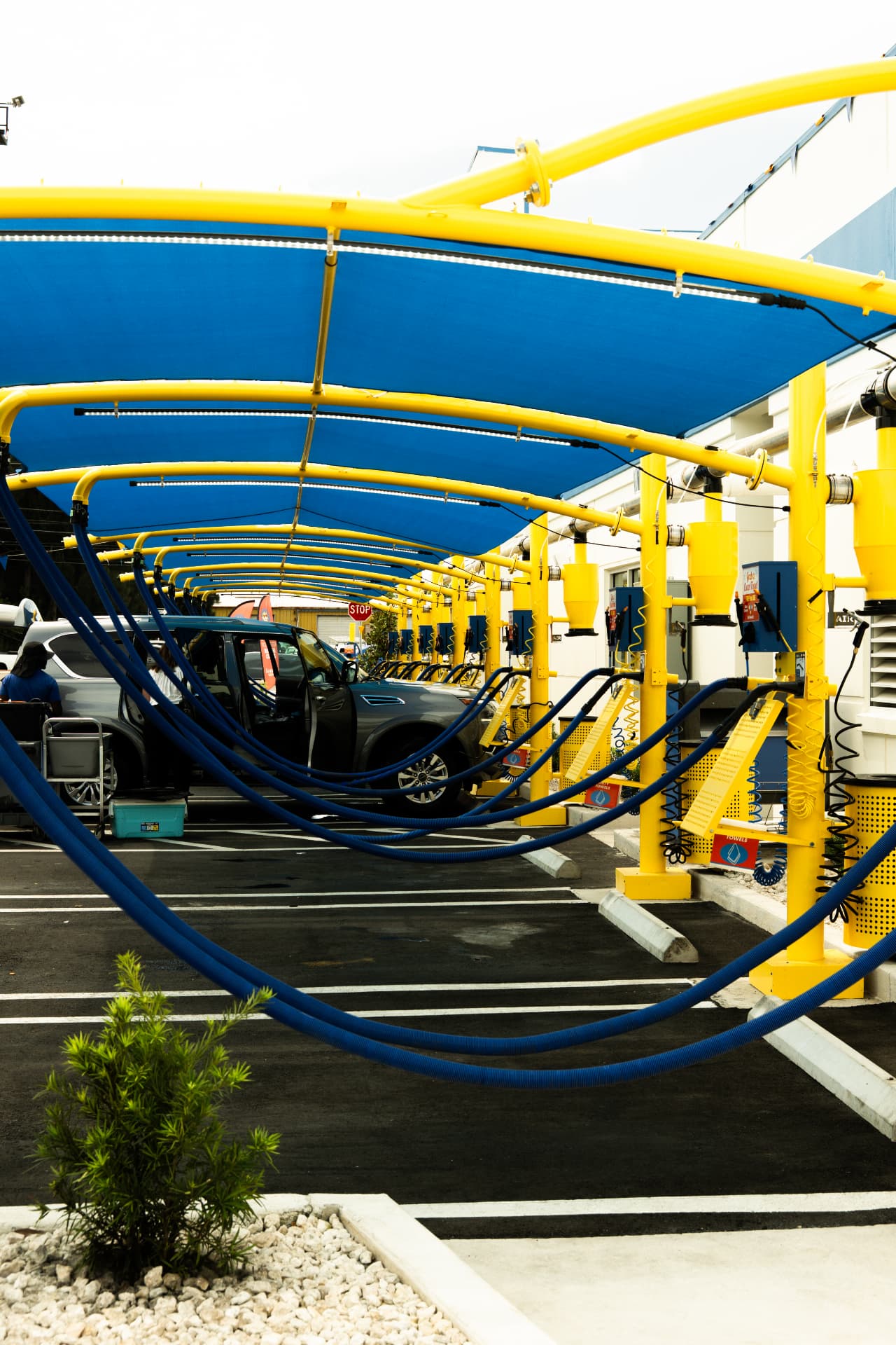 Covered complimentary vacuum bays at Sunshine Car Wash