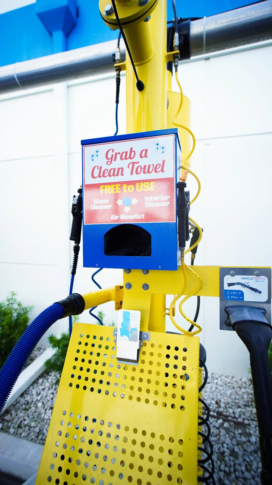 The free Grab a Clean Towel station with glass cleaner, interior cleaner and air blowout at Sunshine Car Wash