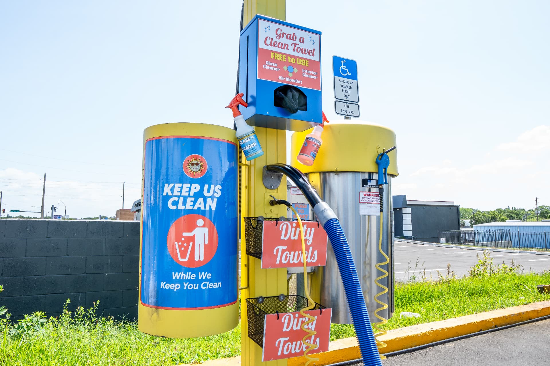 The Grab a Clean Towel station with glass cleaner, interior cleaner and air blowout
