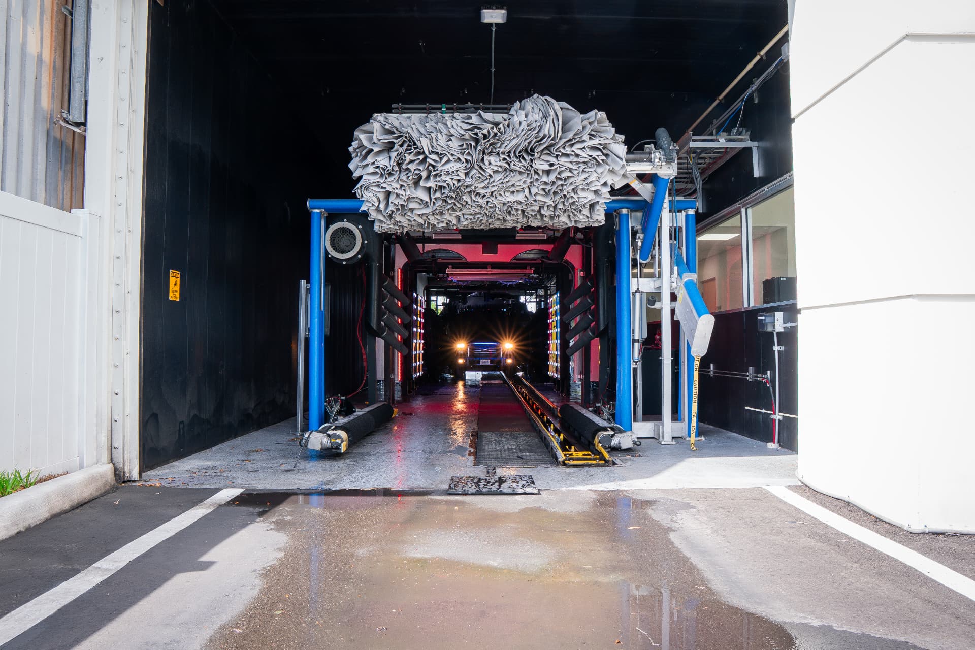 A vehicle approaching the finishing equipment inside the Ulmerton wash tunnel